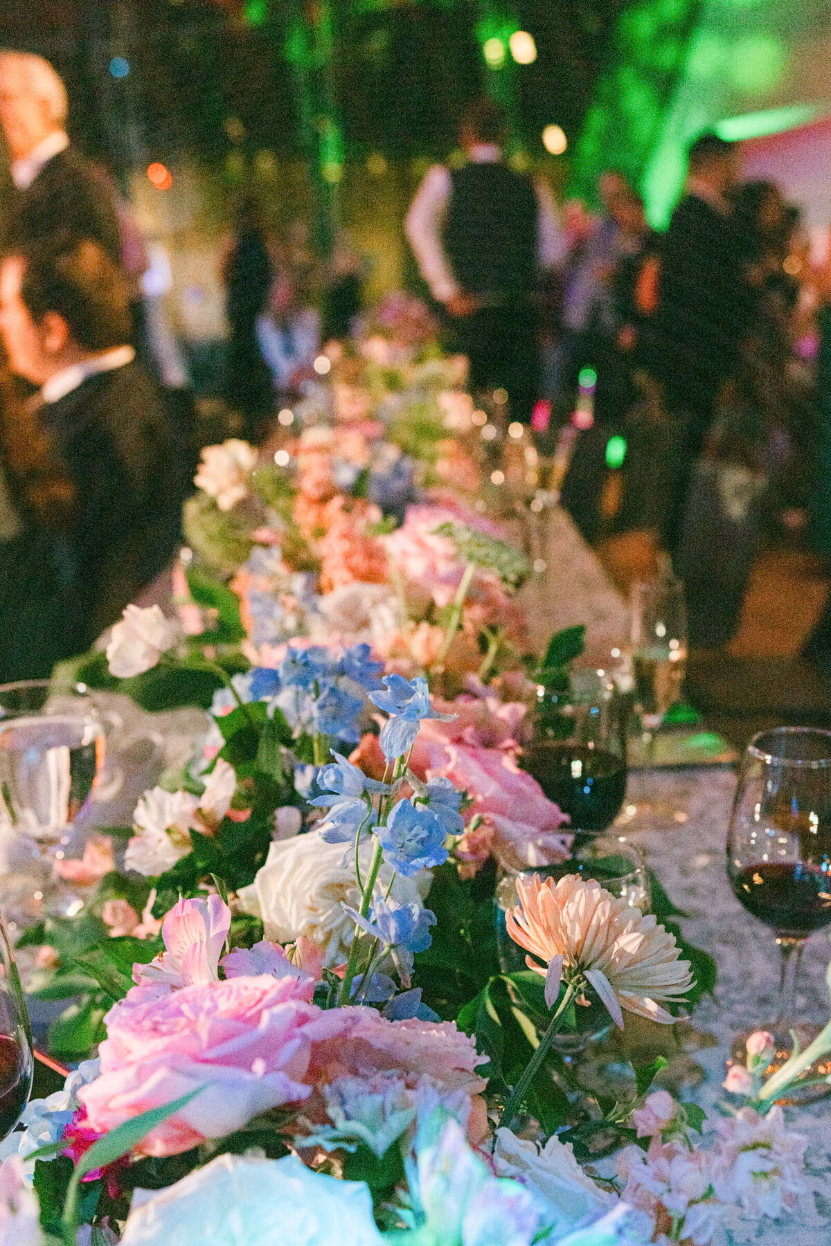 A wedding day photo of the florals on dinner tables at the reception at Crystal Bridges Museum of American Art