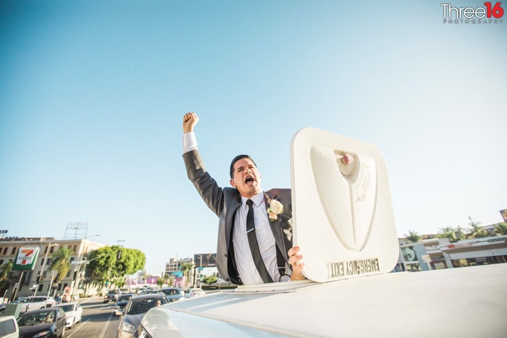 Groom pops out of the limo sky roof while in traffic