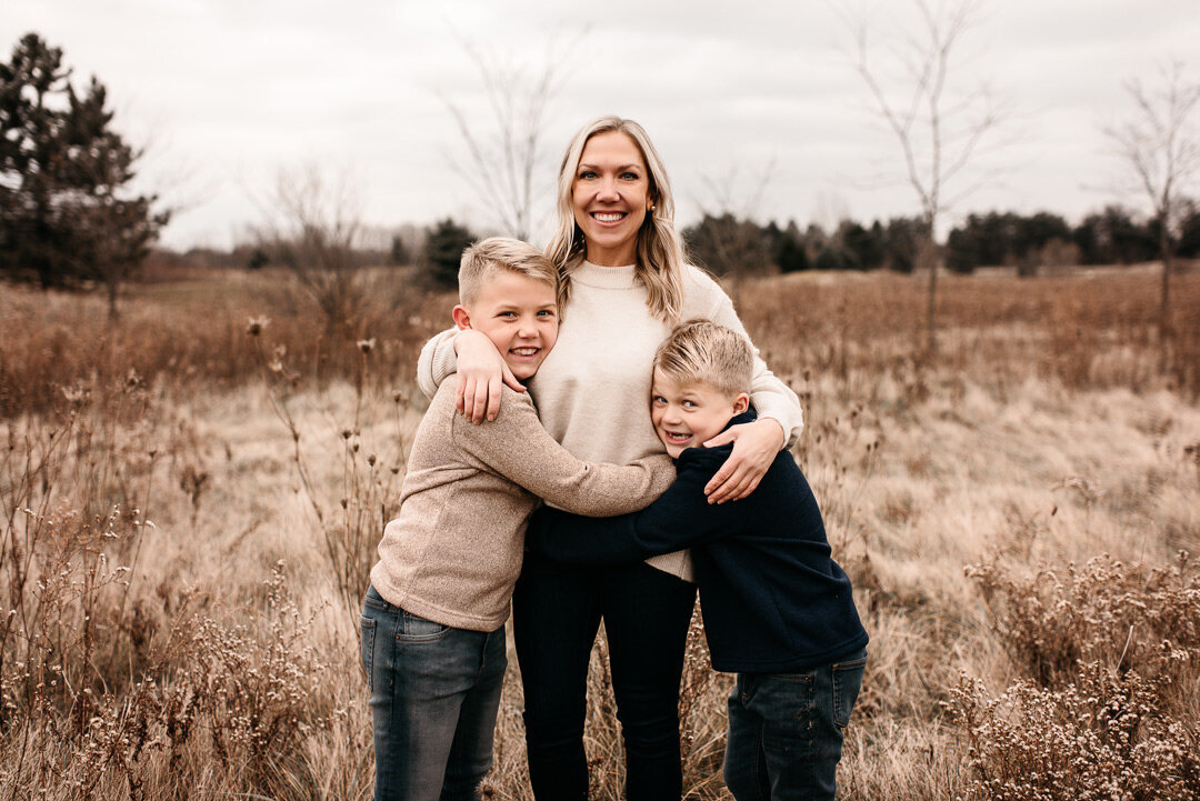 Lansing-Family-Photography-mom-holding-sons-hands-by-For-The-Love-Of-Photography