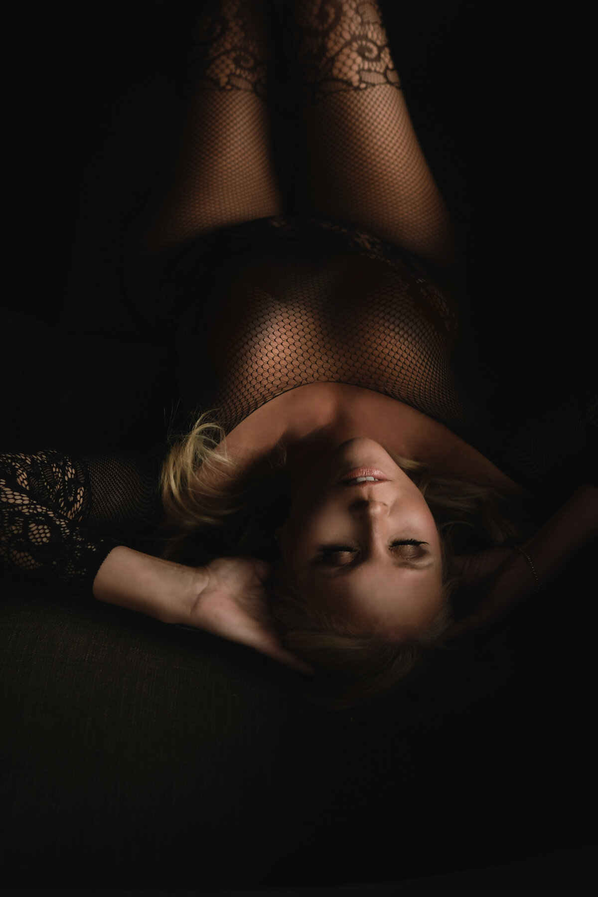 Woman laying in couch with blonde hair