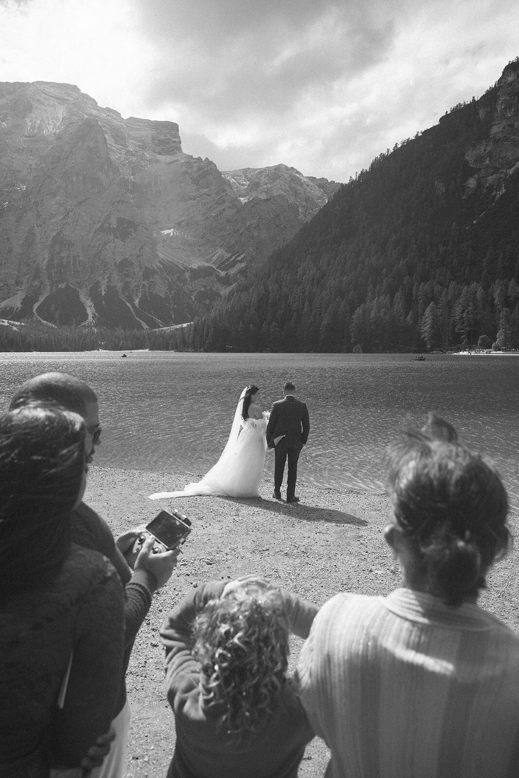 couple elopes on lake braies italy 