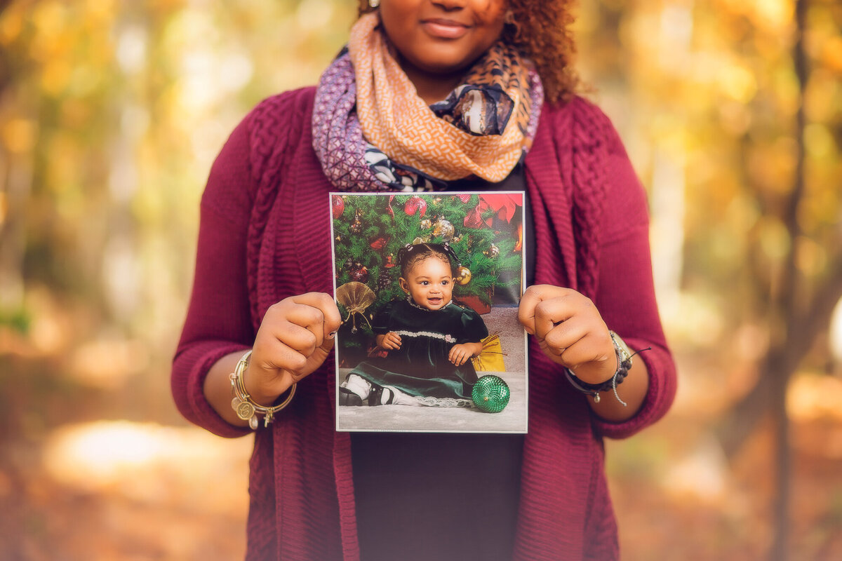 Color image of senior holding her baby image