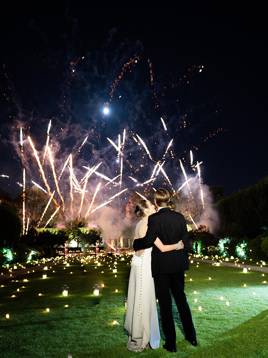 Musee Rodin Wedding by Alejandra Poupel Events B kissing the groom fireworks