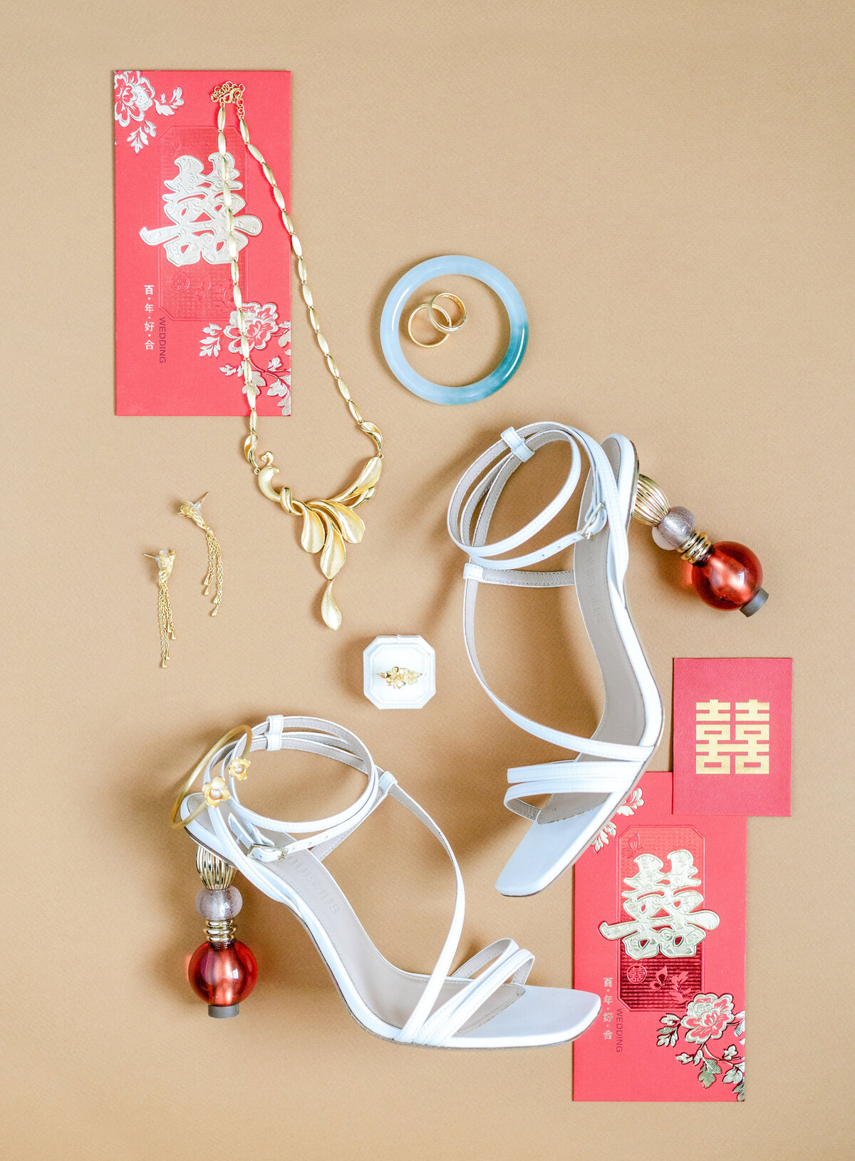 Chinese red envelope and Jacquemus shoes bridal details wedding day flatlay