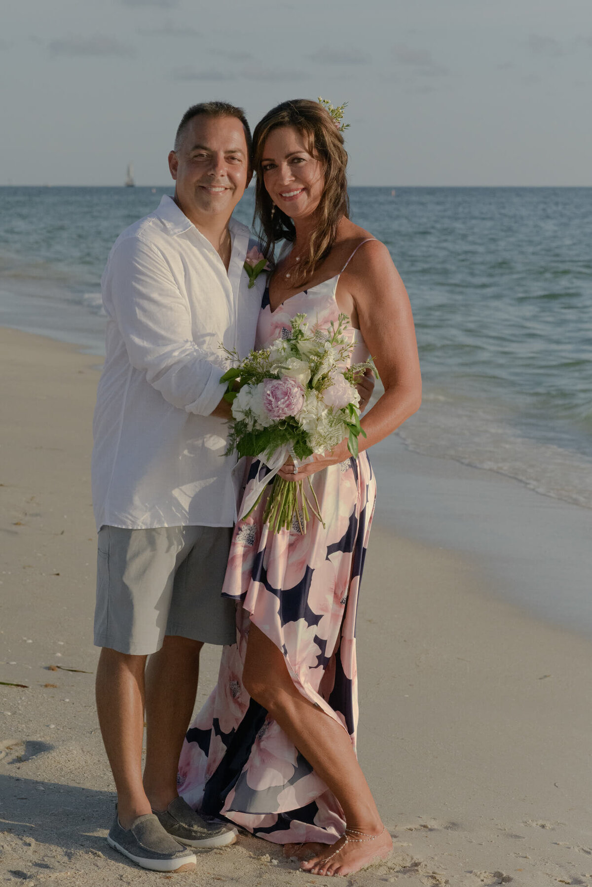 Husband and wife at beach wedding