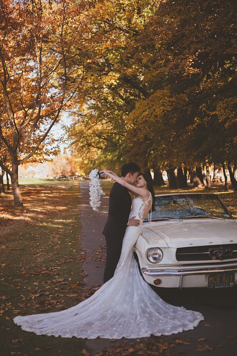 Autumn wedding shoot at Millbrook, Arrowtown. Vintage car & helicopter.