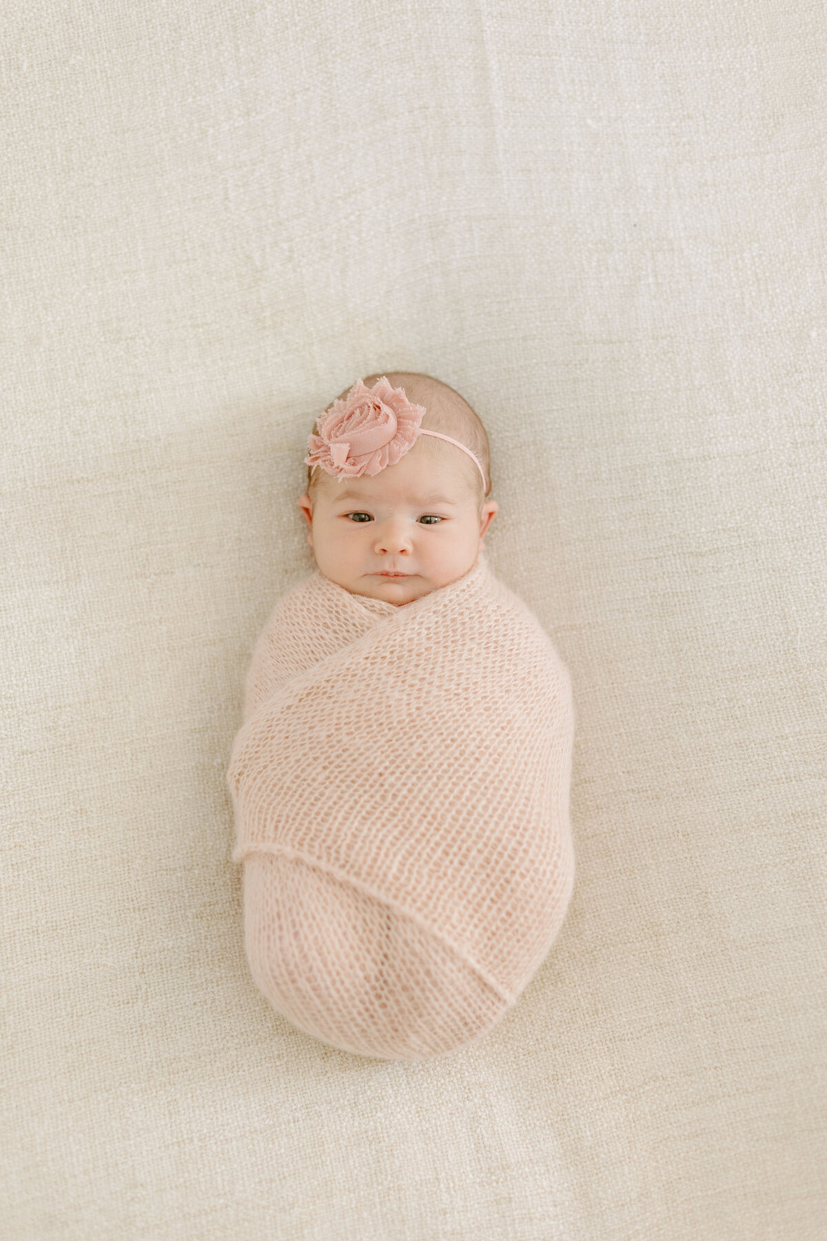 Newborn baby girl with her eyes open