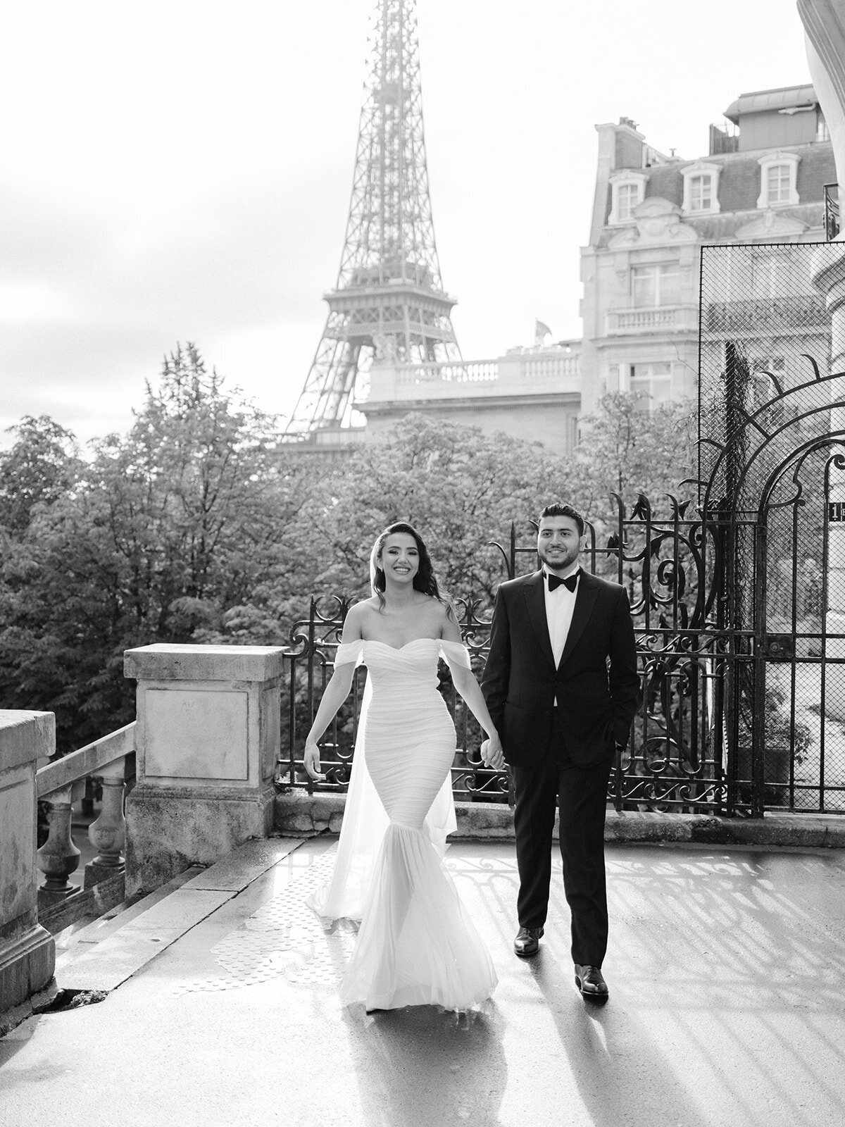 Couple posing with the Eiffel Tower in background