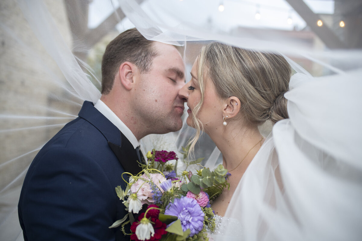 Groom preparing and tying his tie