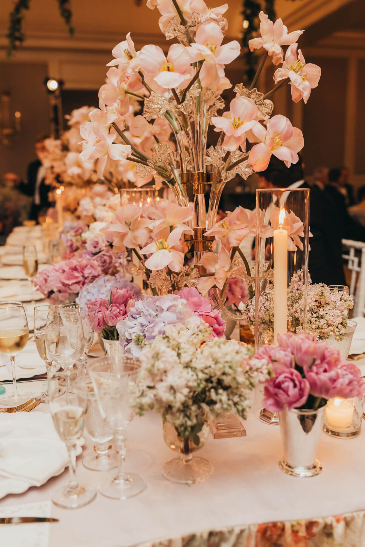 tablescape of florals, pink and white, at ceremony.