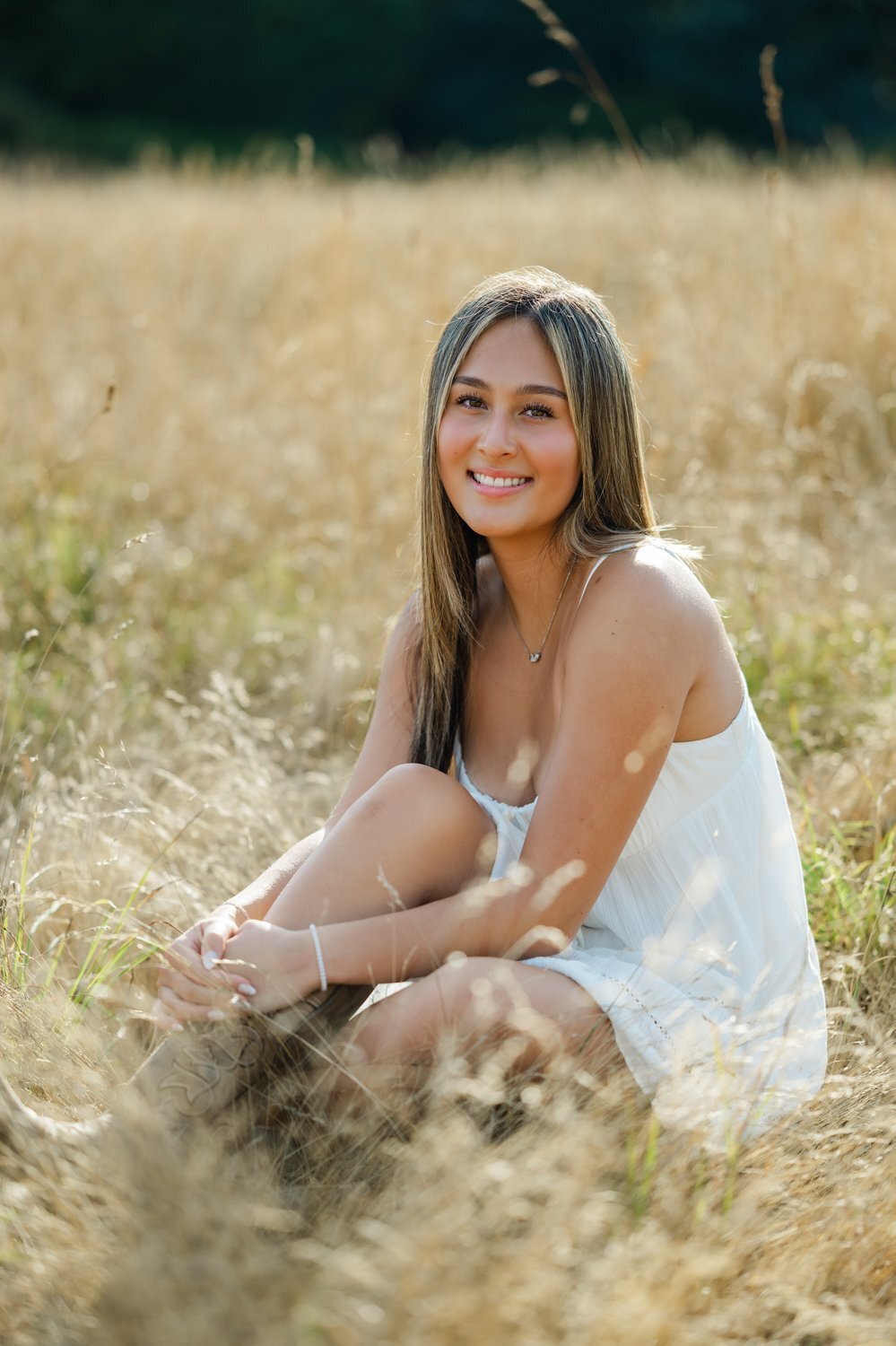 discovery park field senior portrait  sitting in dry grass