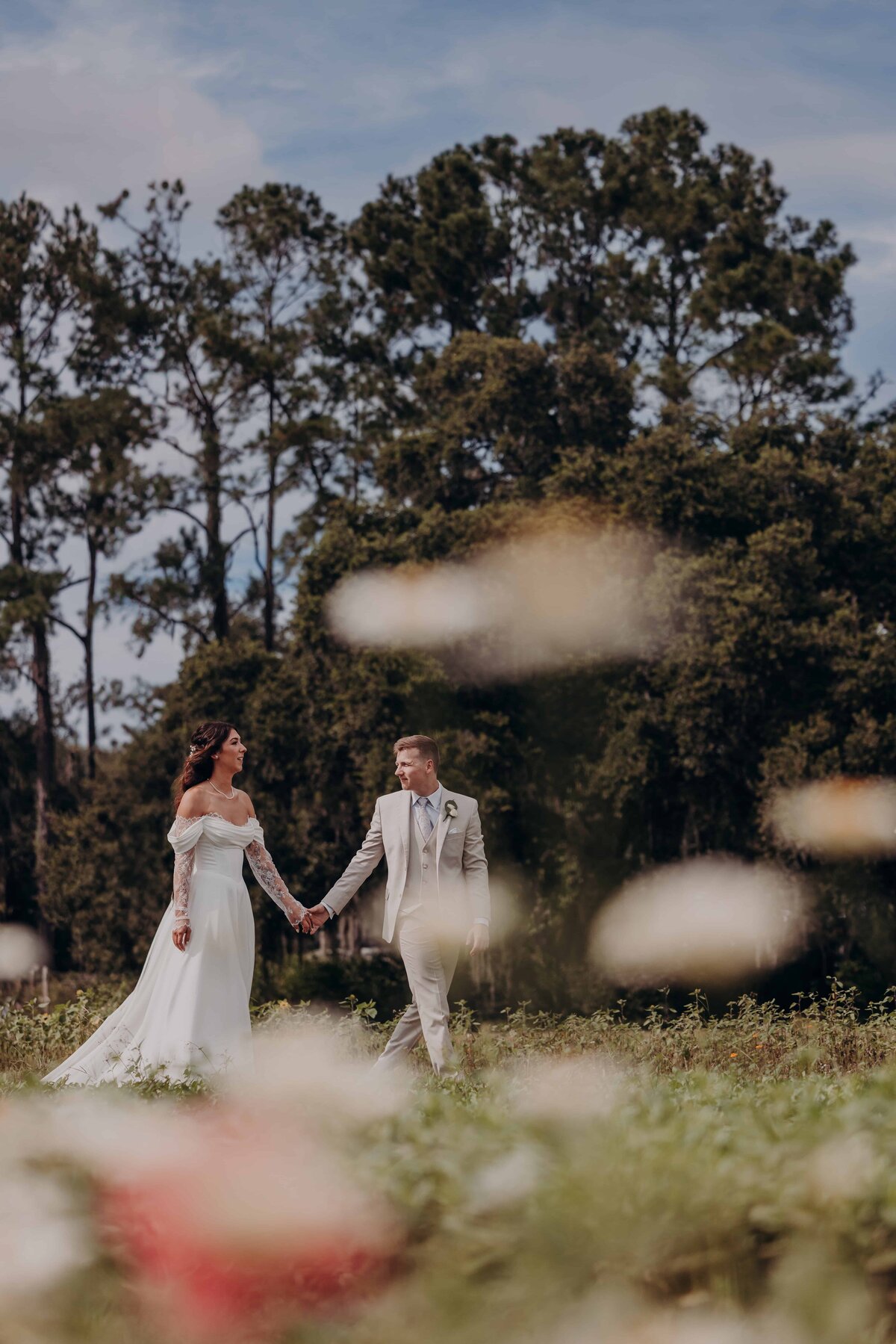 Bride and groom portraits in the flower fields at the seffner flower barn a florida wedding venue