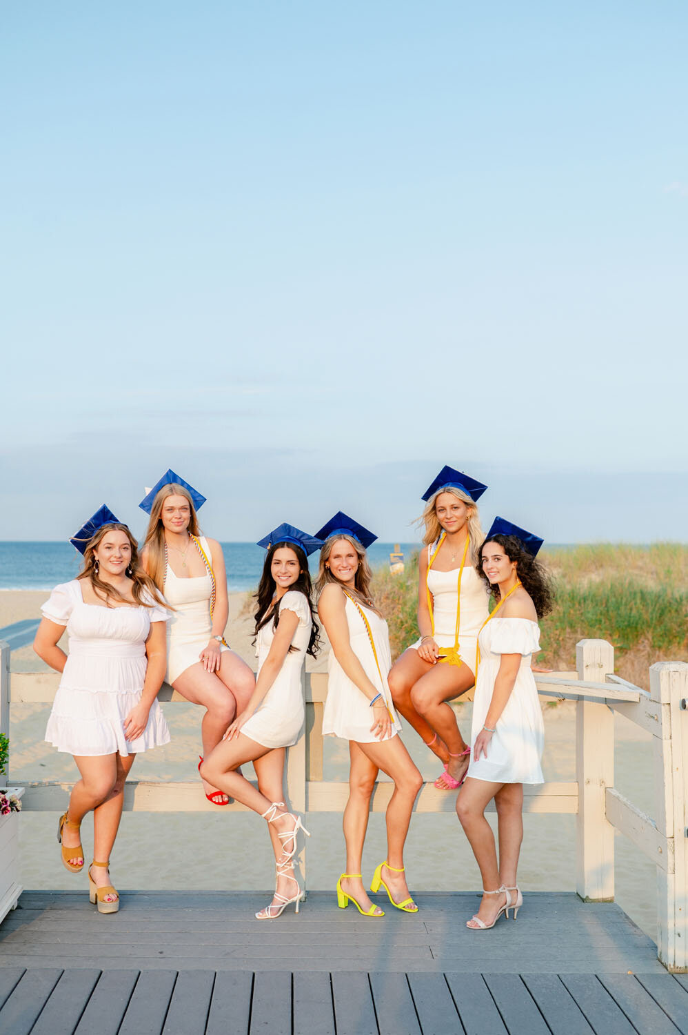 NJ senior photoshoot fun friends shoot cap and gown spring lak sea girt beach shoot white dresses-372