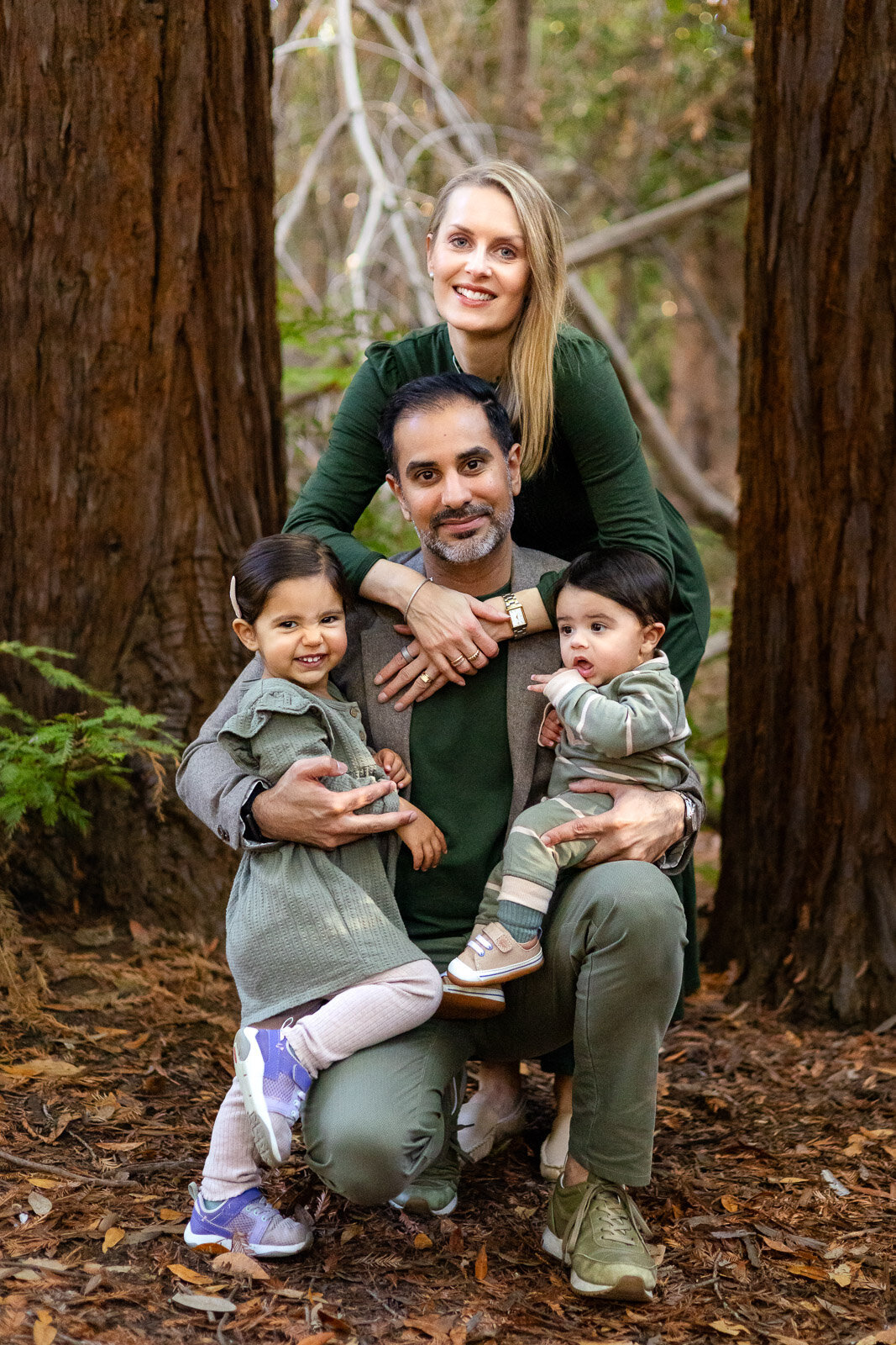 Family cuddling together in the redwoods during a fall portrait session – Bay Area Family Portfolio – Ellobelle Photography
