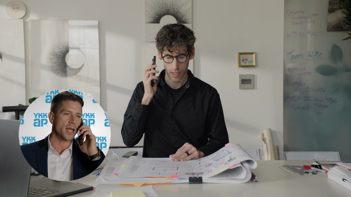 YKK AP Rep talking on the phone to an architect