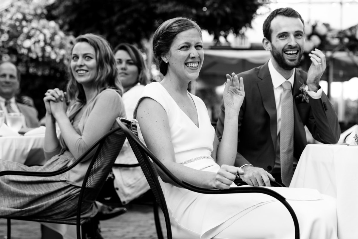 Common-Man-Italian-Greenhouse-New-Hampshire-Wedding-Photographer-Summer-Greenhouse-BHLDN-Bride-Groom-Laughing-Toast-Photo