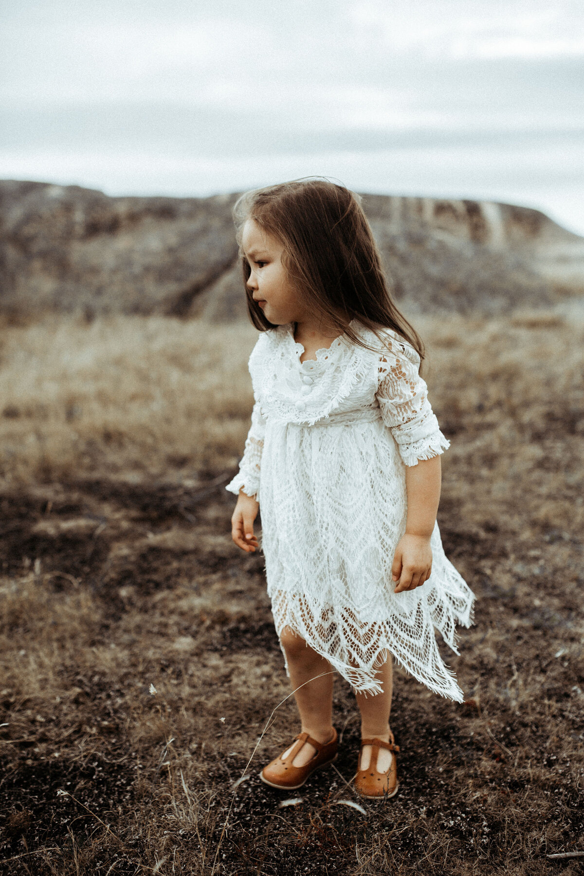 Little girl in white lace dress on Family Photoshoot. Moody, Romantic Portraits in Melbourne with Sapphire and Stone Photography