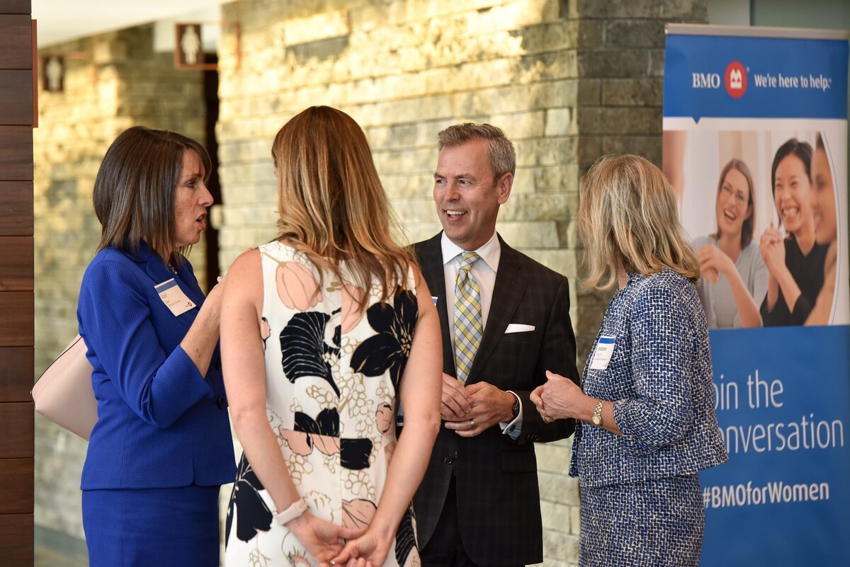 Dynamic speakers engaging with the audience at a charity event in Toronto, showcasing professional event photography