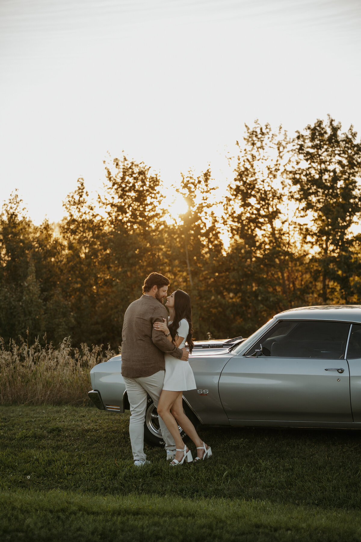 Photo of couple in front of sports car Edmonton