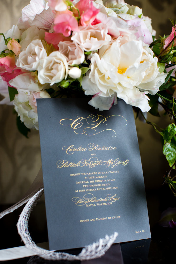 Black and gold wedding invitations for this wedding featuring peonies and sweet peas.