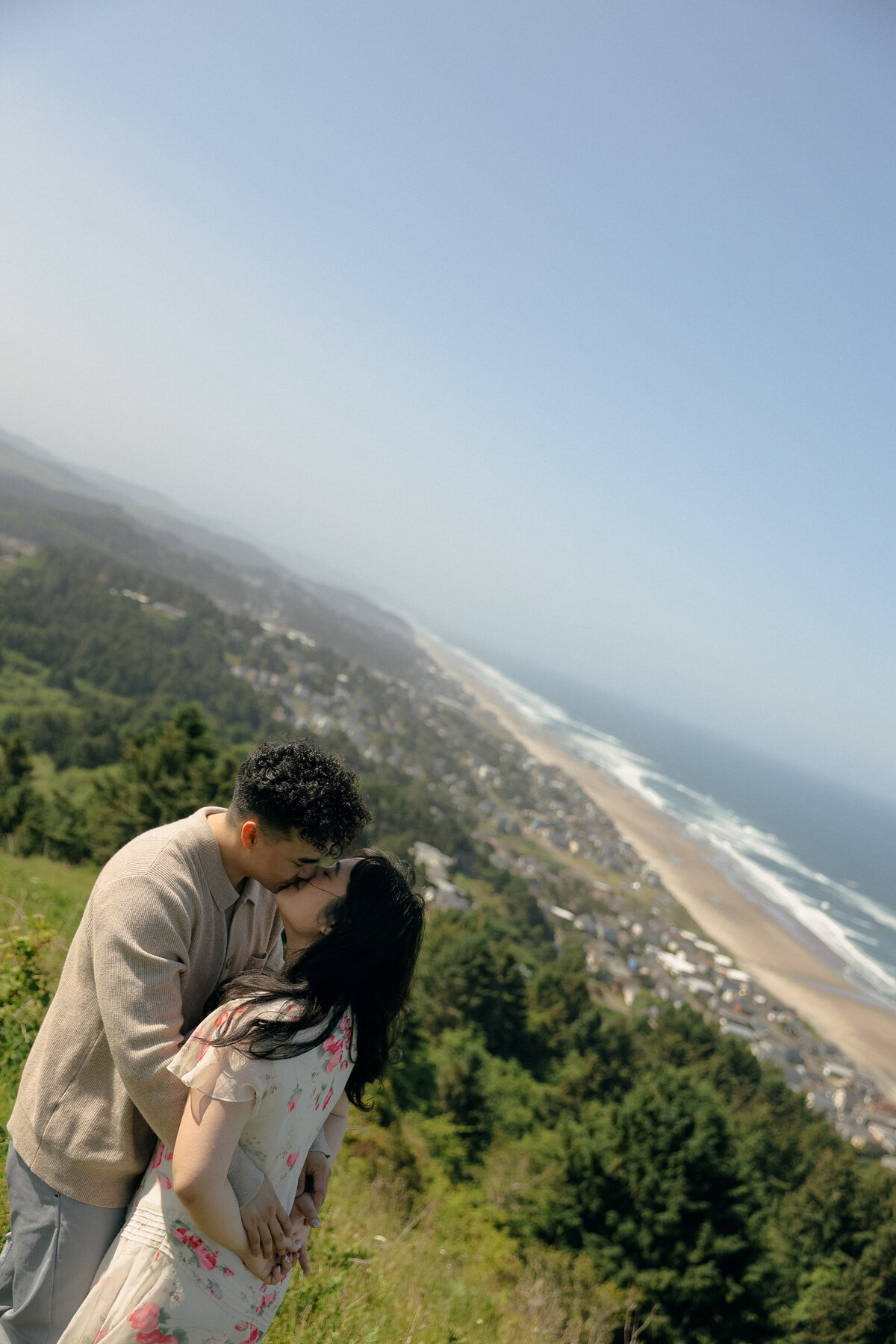 Coastal Oregon Engagement Session Kissing Overlooking Ocean Viewpoint