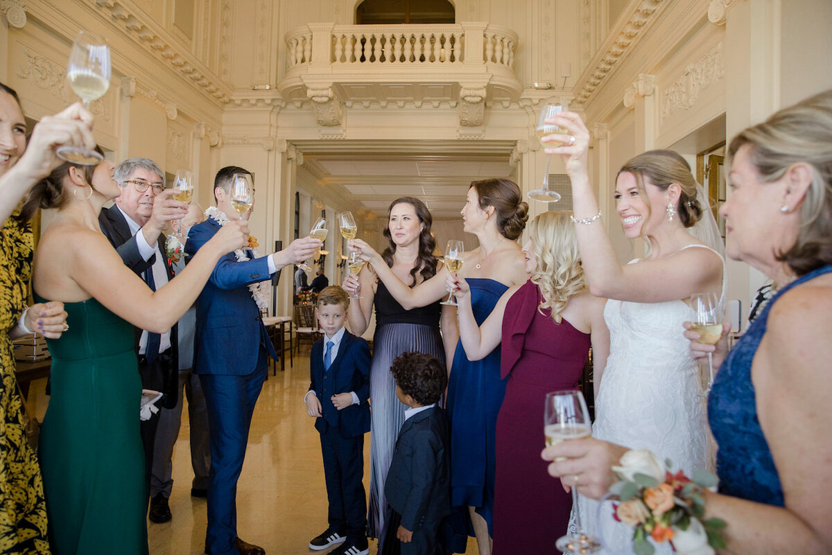 Couple toasting at Flood Mansion CA wedding