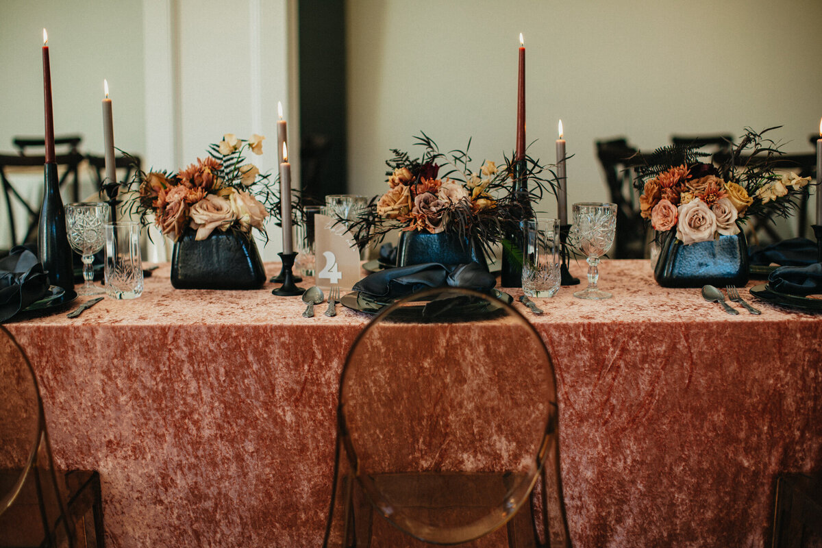 tablescape with velvet linen and tall candles