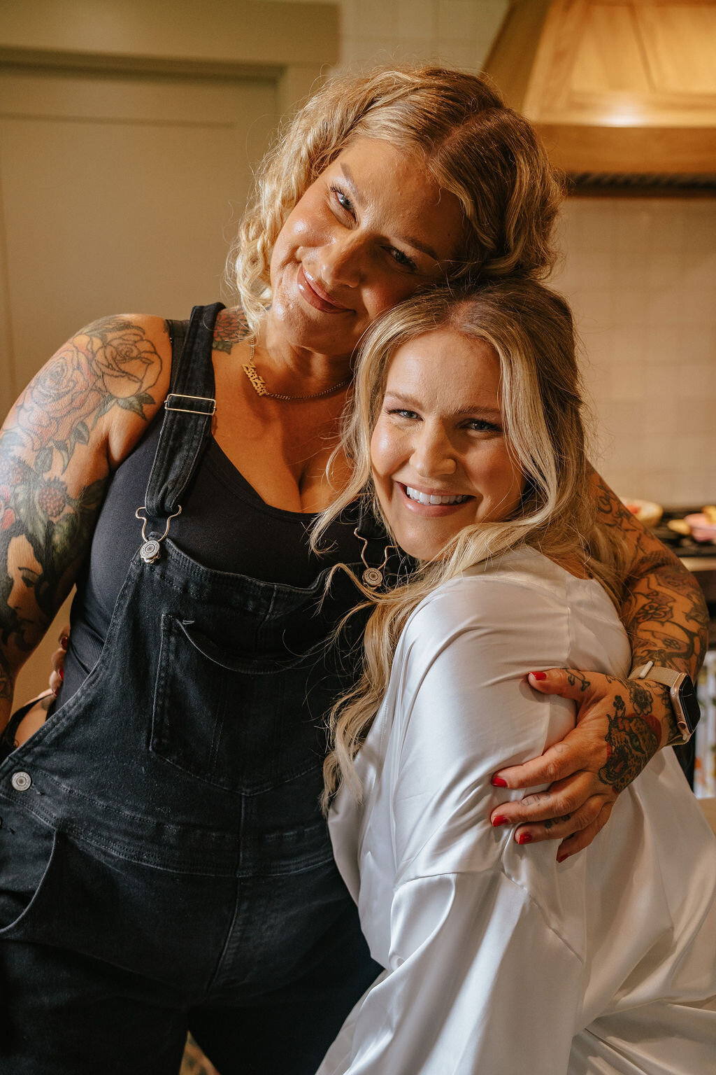 Libby hugging a client representing bridal makeup done by Looks with Libby.