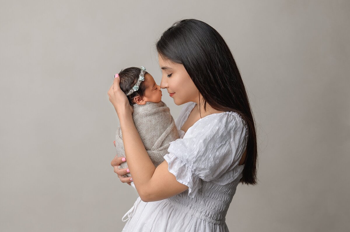 Mommy and me portrait with newborn baby in Wellington, FL portrait studio.
