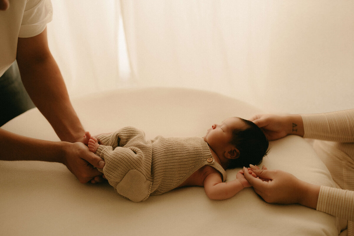 Baby wrapped in warm neutral tones during Nashville TN newborn photo shoot