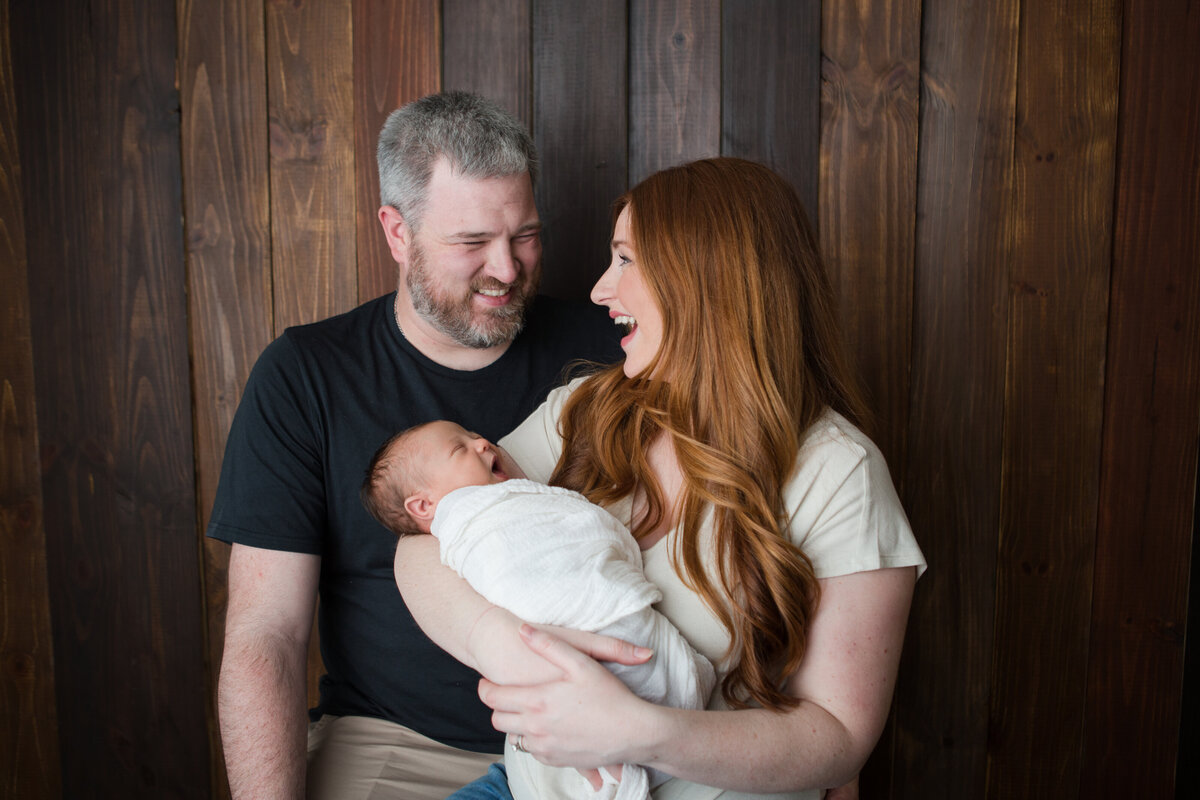 Newborn Family Picture with Family Laughing
