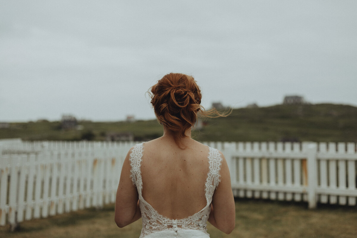 back of bride in her wedding dress