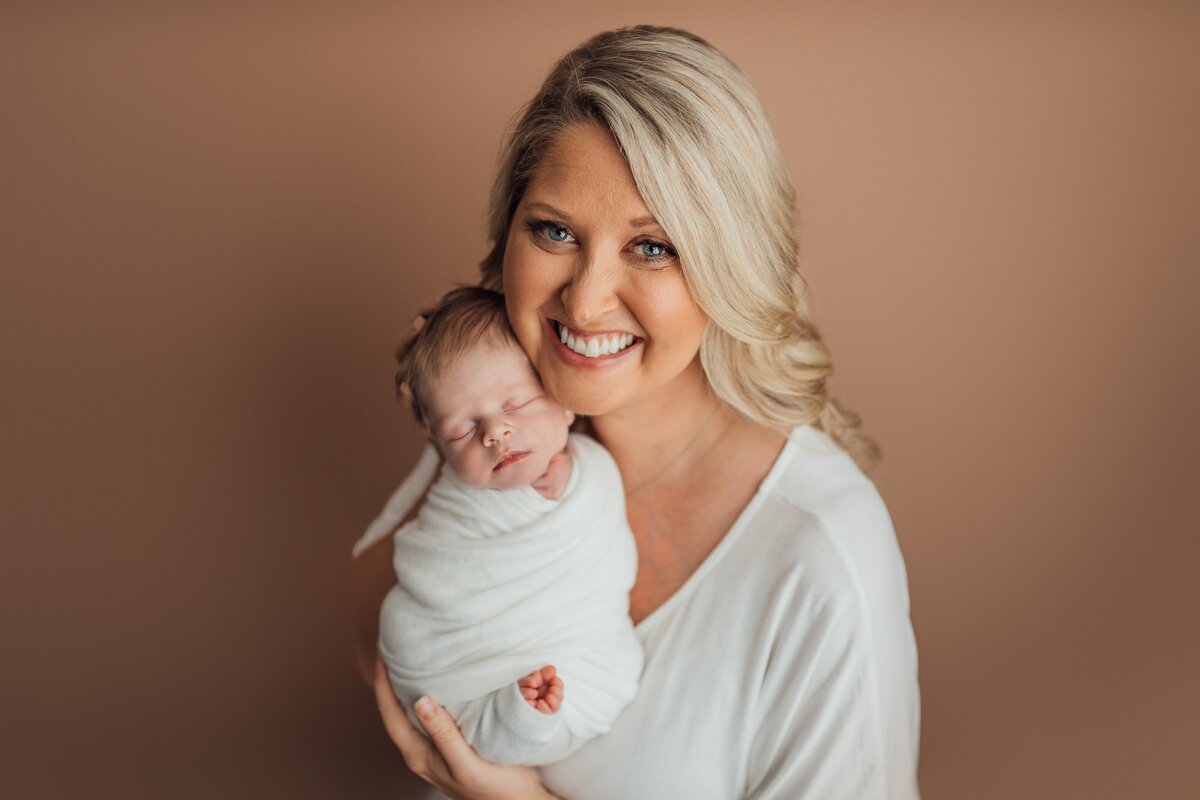 mom and baby during newborn photosession in tampa
