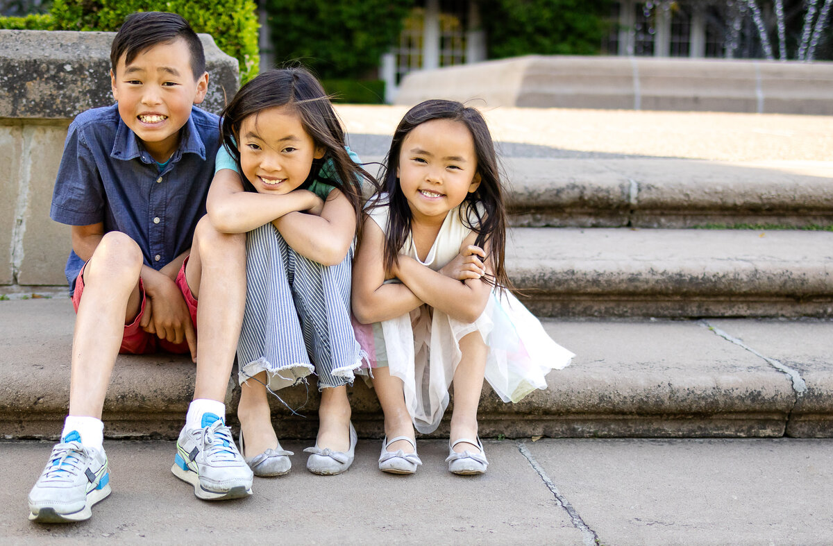 three siblings children during a playful outdoor session – lifestyle family photography by Ellobelle Photography, San Francisco Peninsula kohl mansion Burlingame