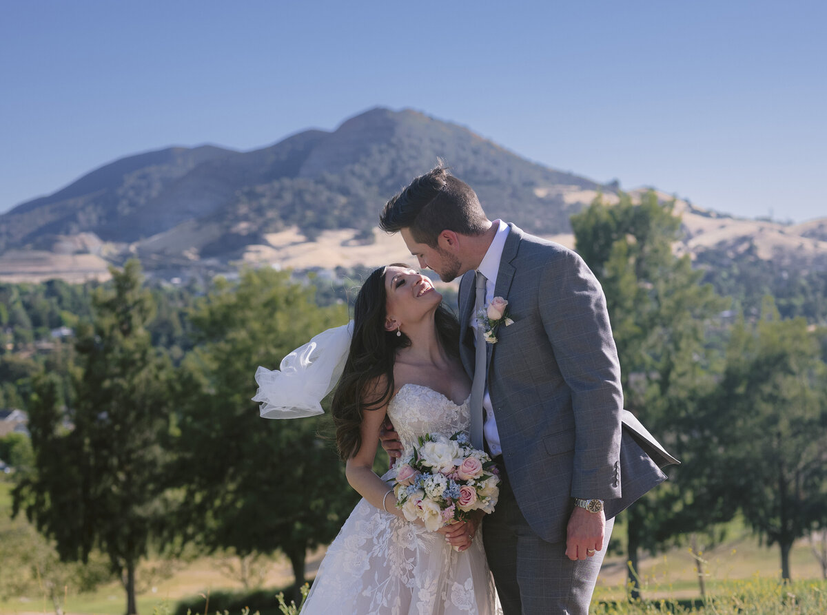 wedding couple about to kiss