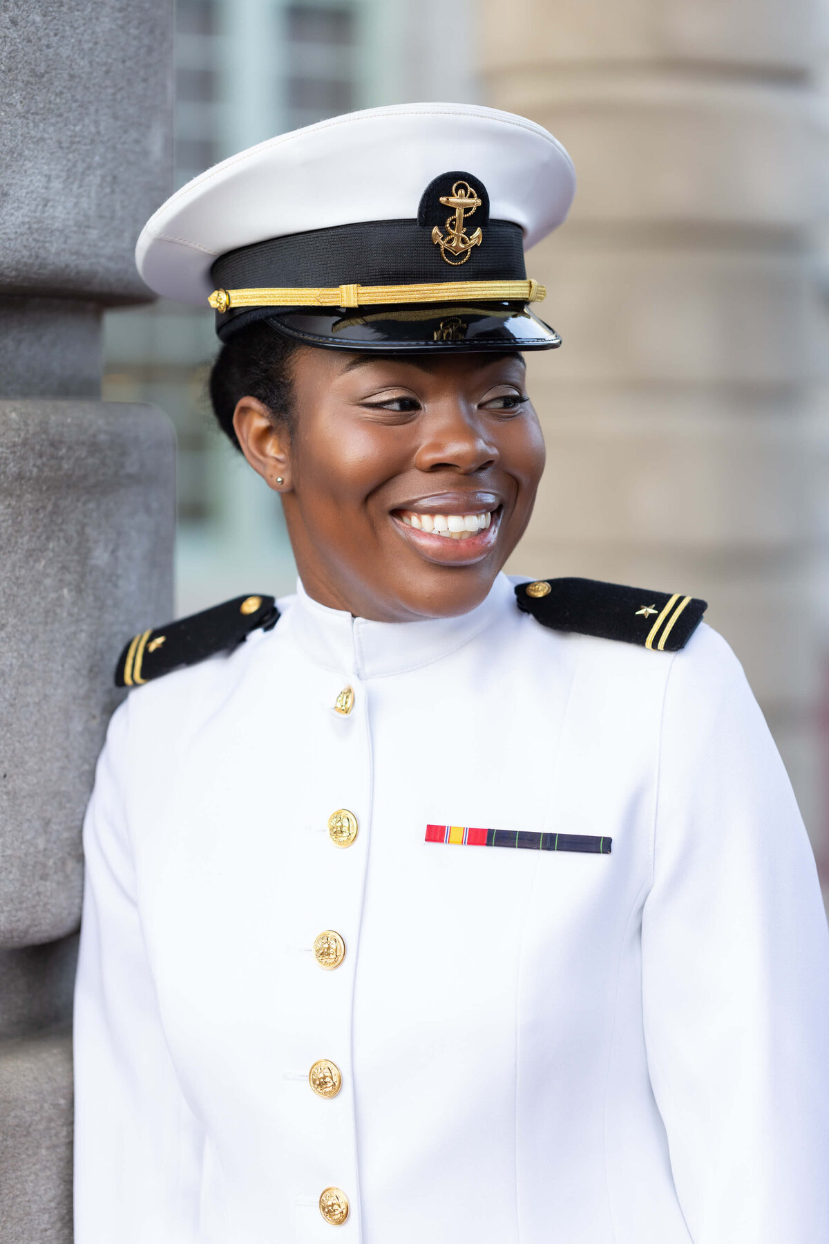 Navy officer in white uniform.