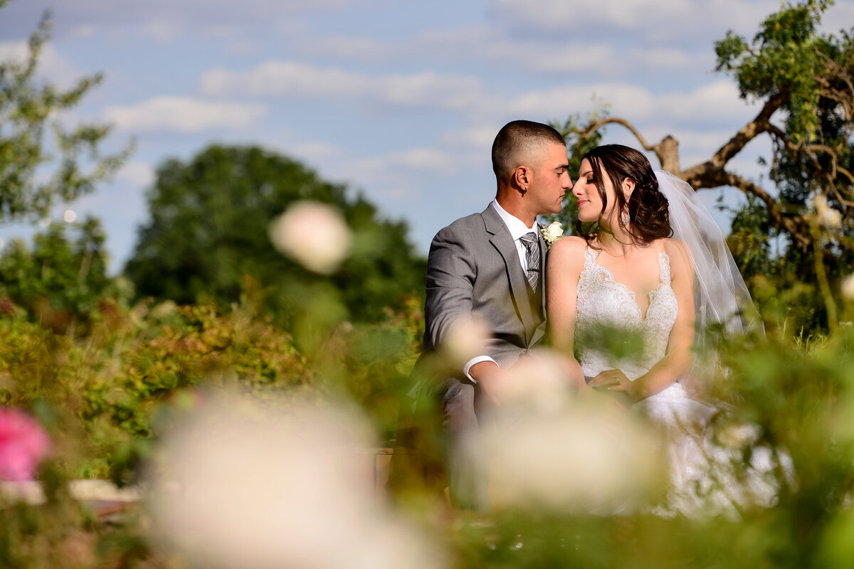 A bride and groom sharing a moment while doing wedding photos at the Gulf Steak house in Kitchener, Ontario.