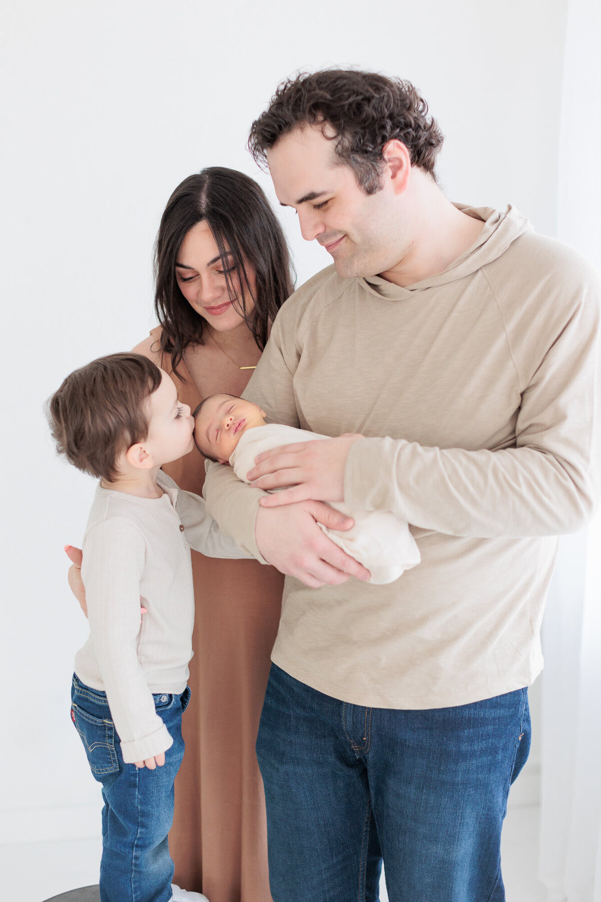 Family of 4 in Tiffany Hix Photography portrait studio during Boise newborn photo session