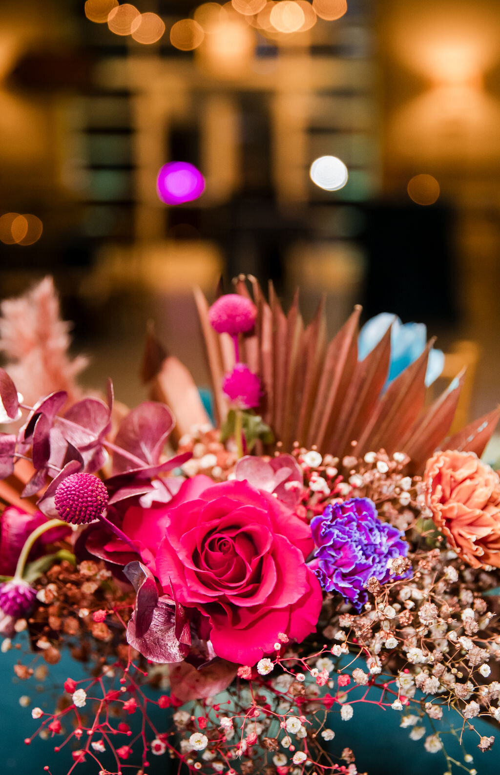 Vibrant hot pink and purple floral centerpiece at a Bat Mitzvah at Stone House in Warren, NJ.