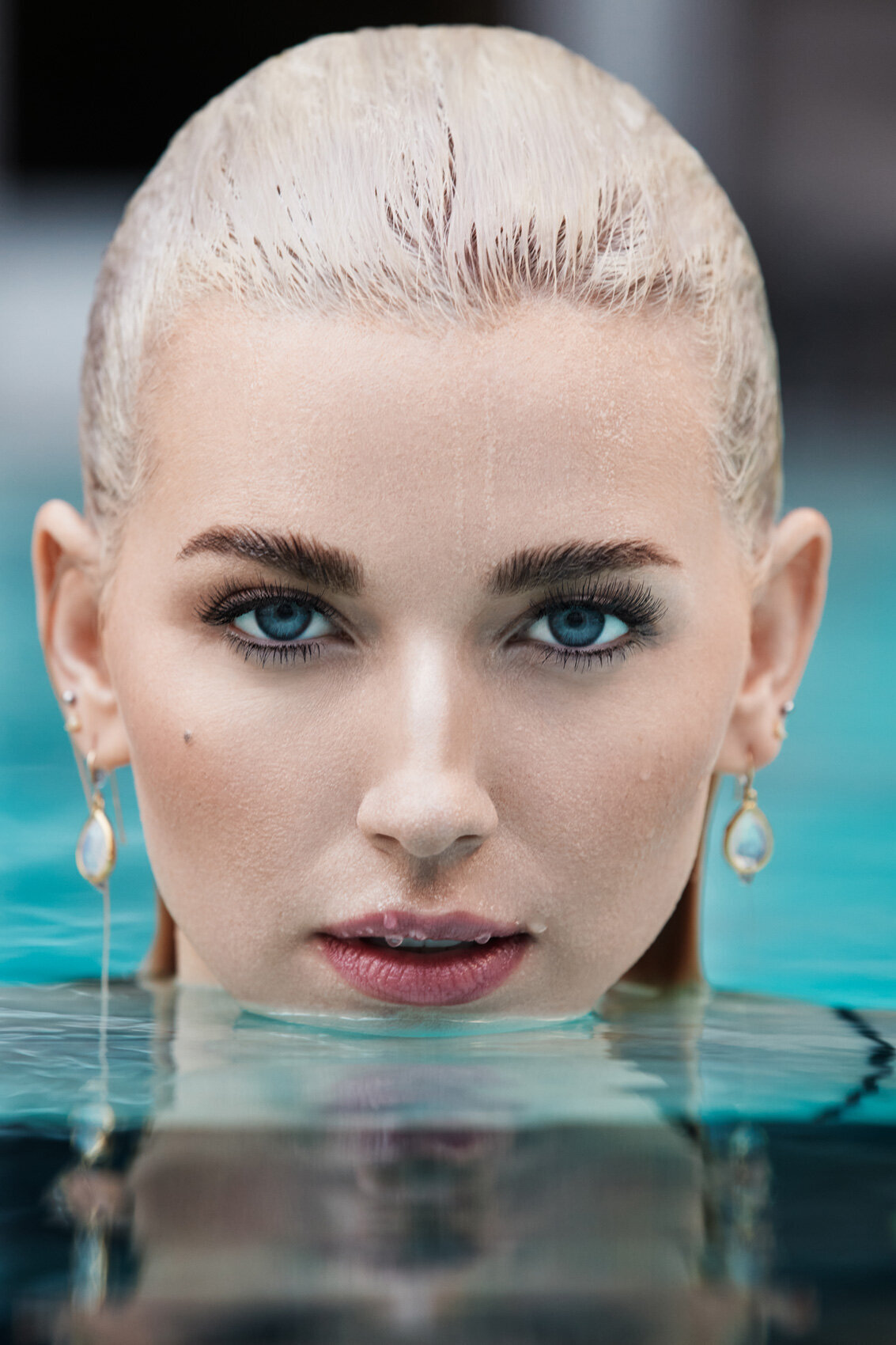 Melissa Goodwin in a crisp, professional portrait, exuding confidence and elegance, captured by Ylva Erevall.