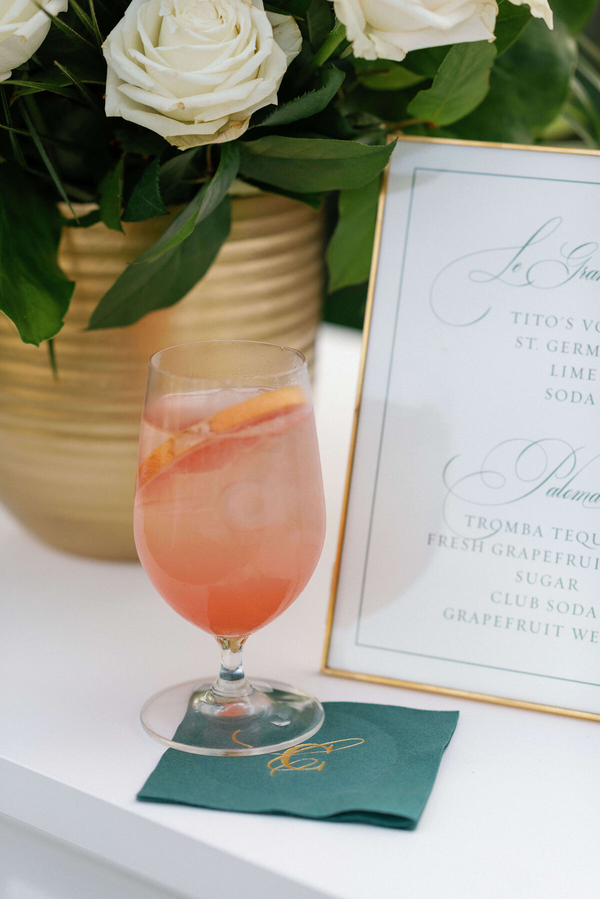 35.Signature Grapefruit Paloma with Custom Green Wedding Napkins - Poeme