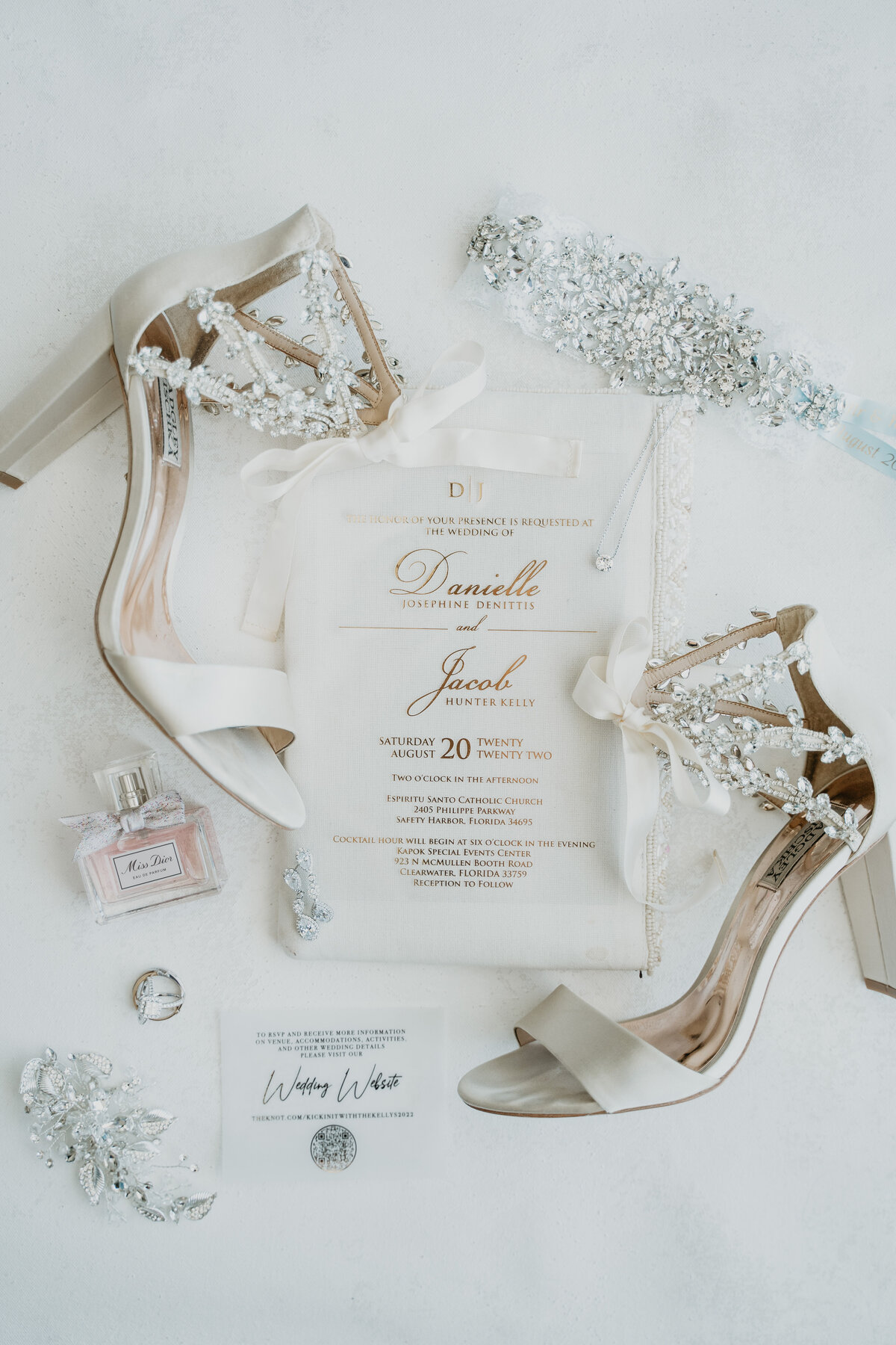 Photo of brides wedding details including ring shoes and jewelry