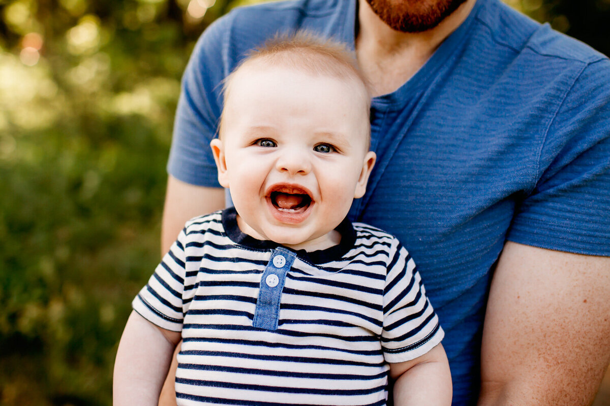 6 month old boy smiling during family photography session