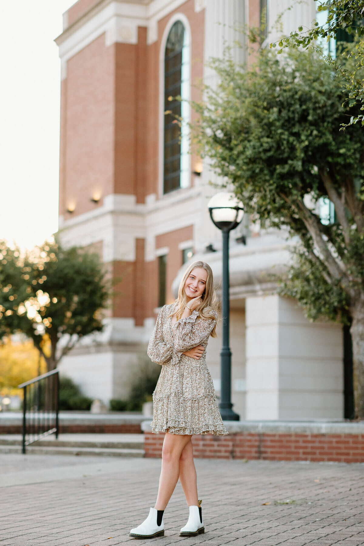 senior posing at school by senior photographers in nashville tn