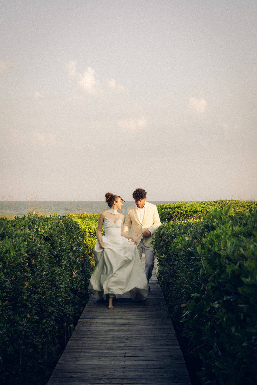 bride-and-groom-running-photos-kiawah-island