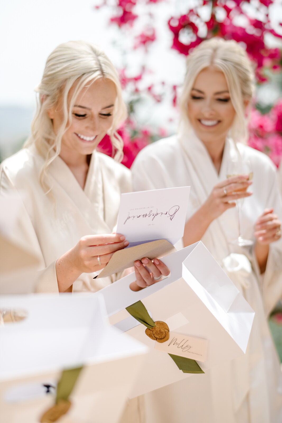 bridesmaids receiving personalized gift from bride