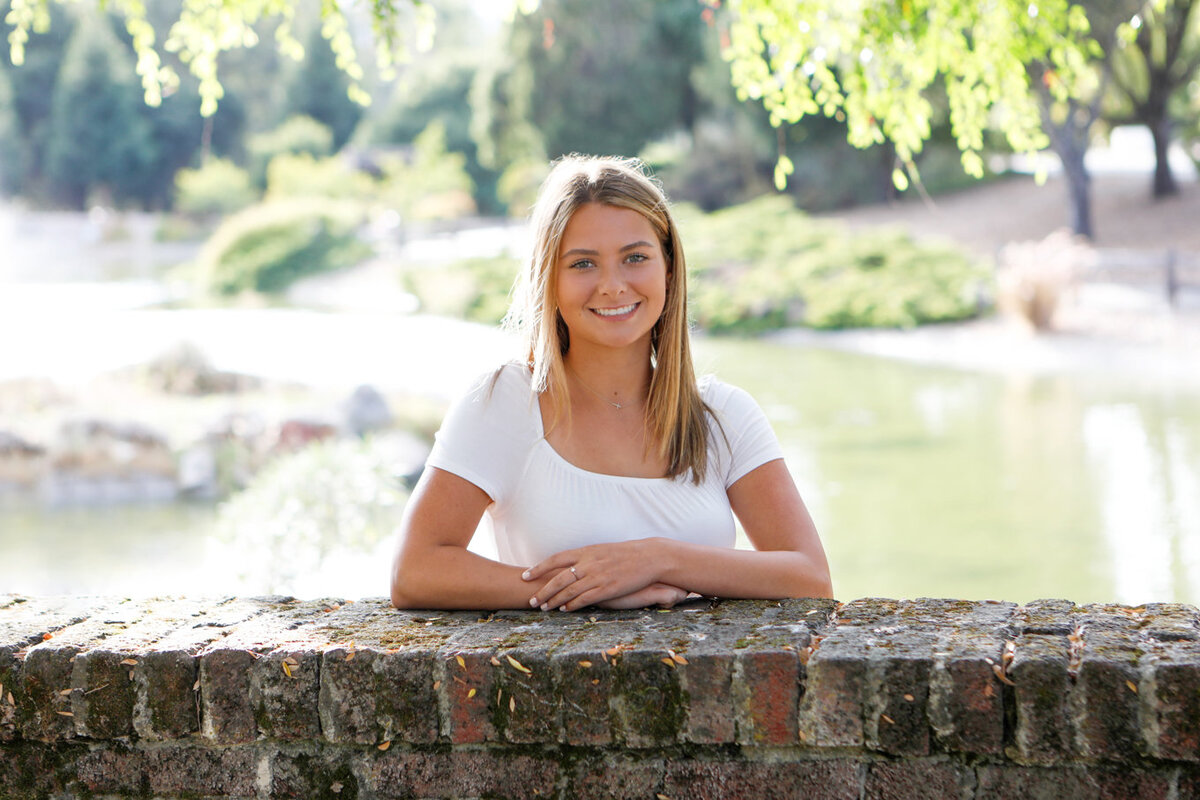 Senior girl in front of lake