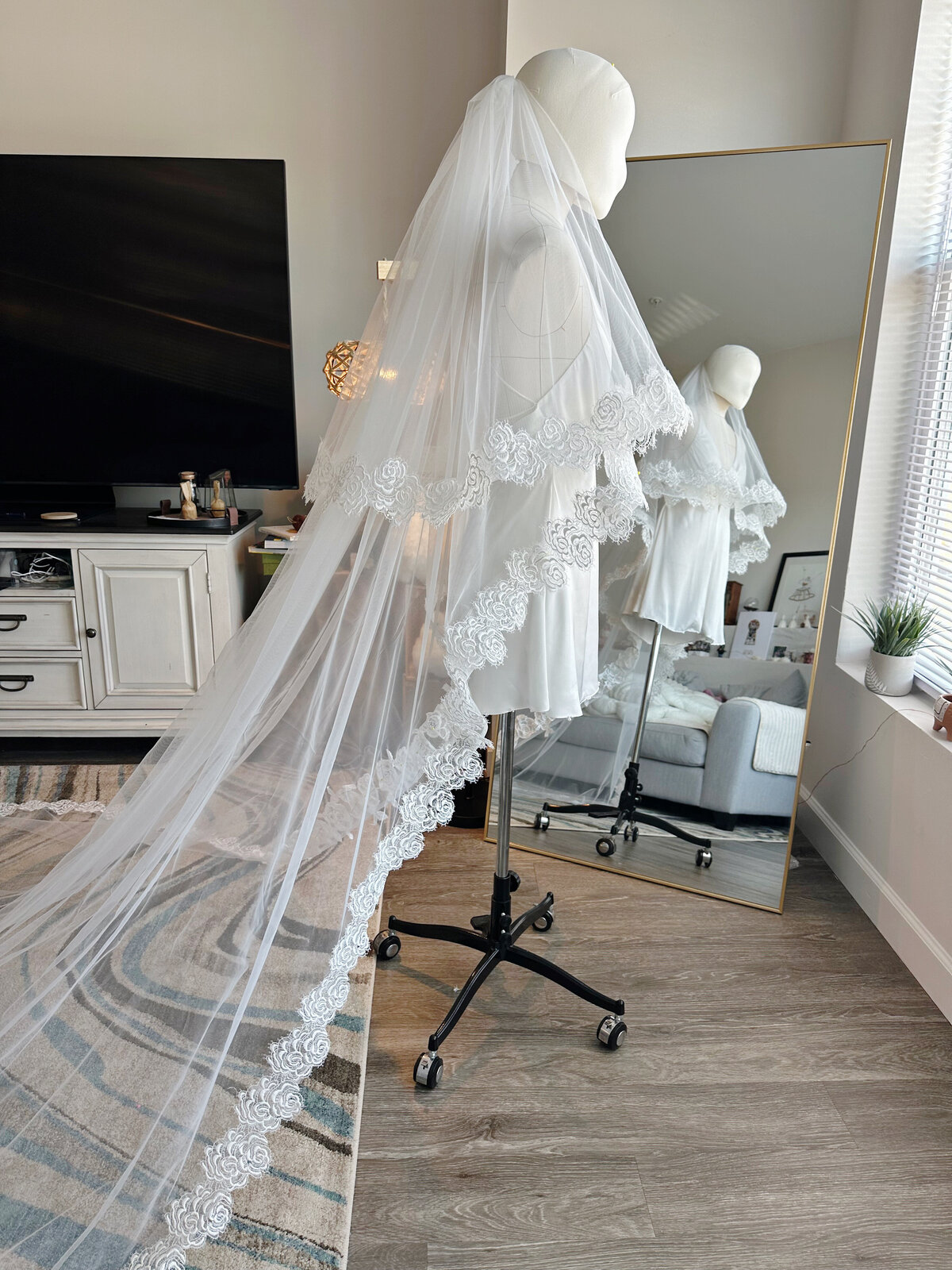 Soft flowing blusher veil secured with comb attachment
