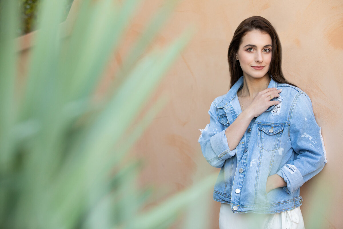 A girl leaning against a wall