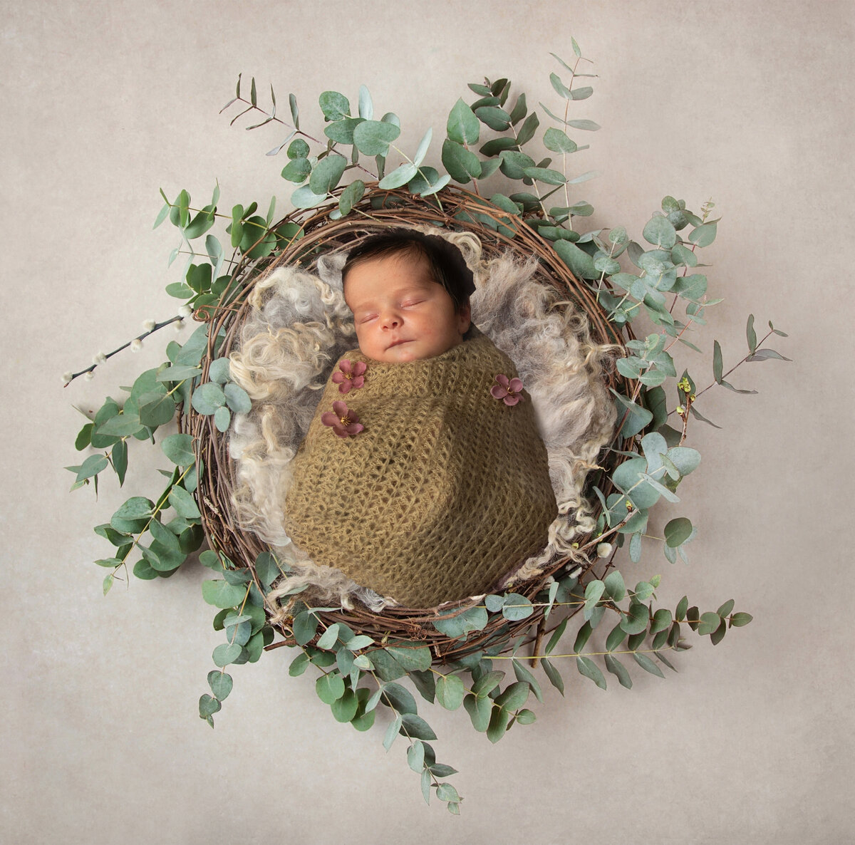 Baby in wreath basket